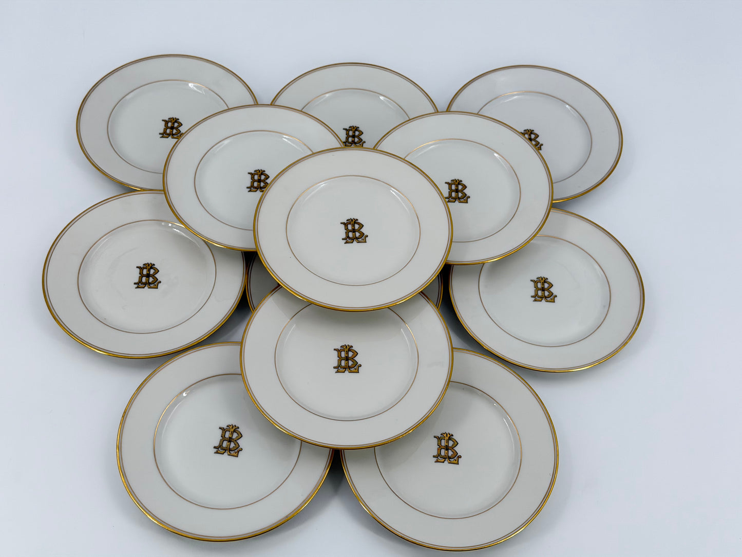 Set of Theodore Haviland monogrammed bread plates
