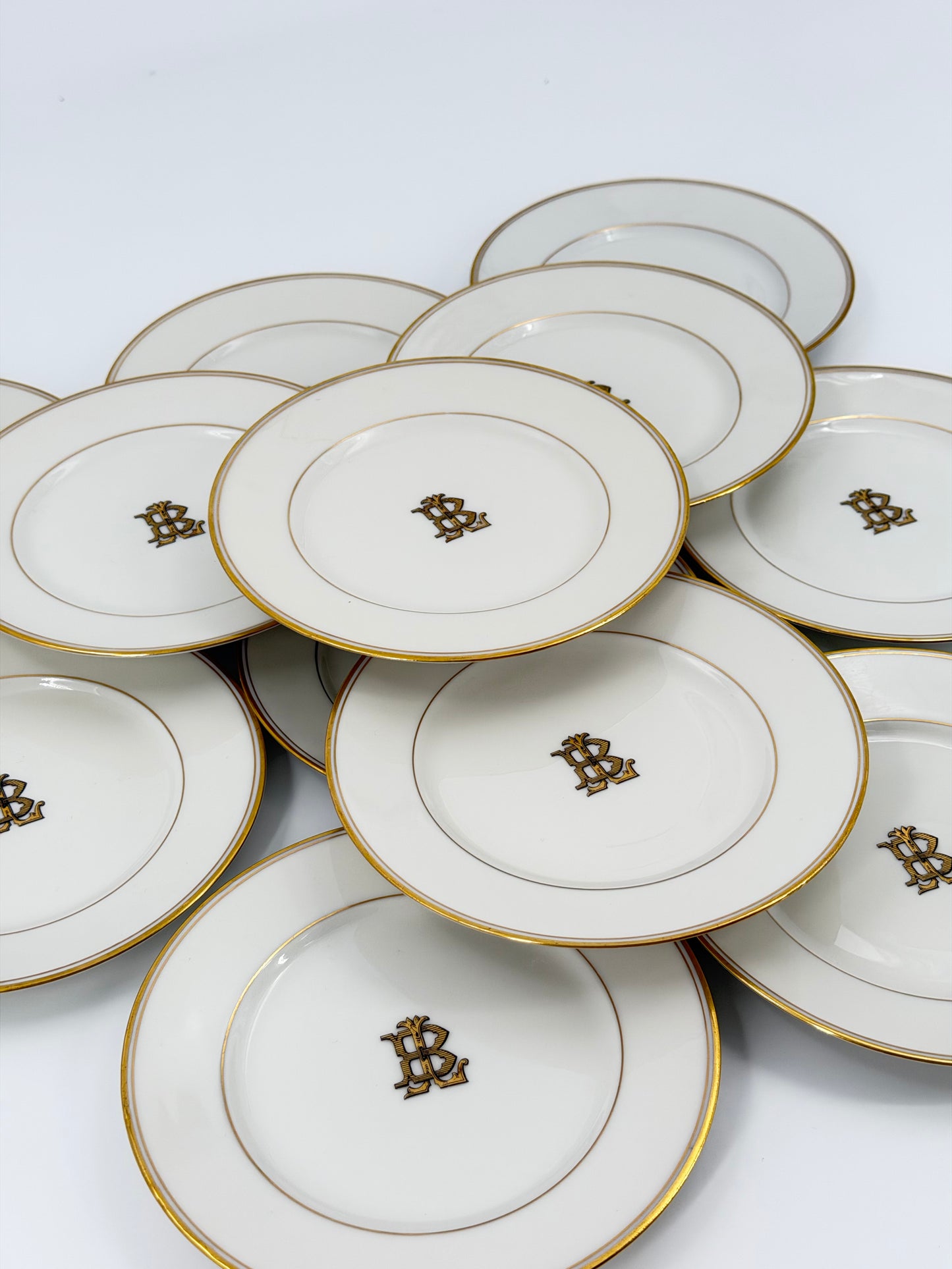 Set of Theodore Haviland monogrammed bread plates