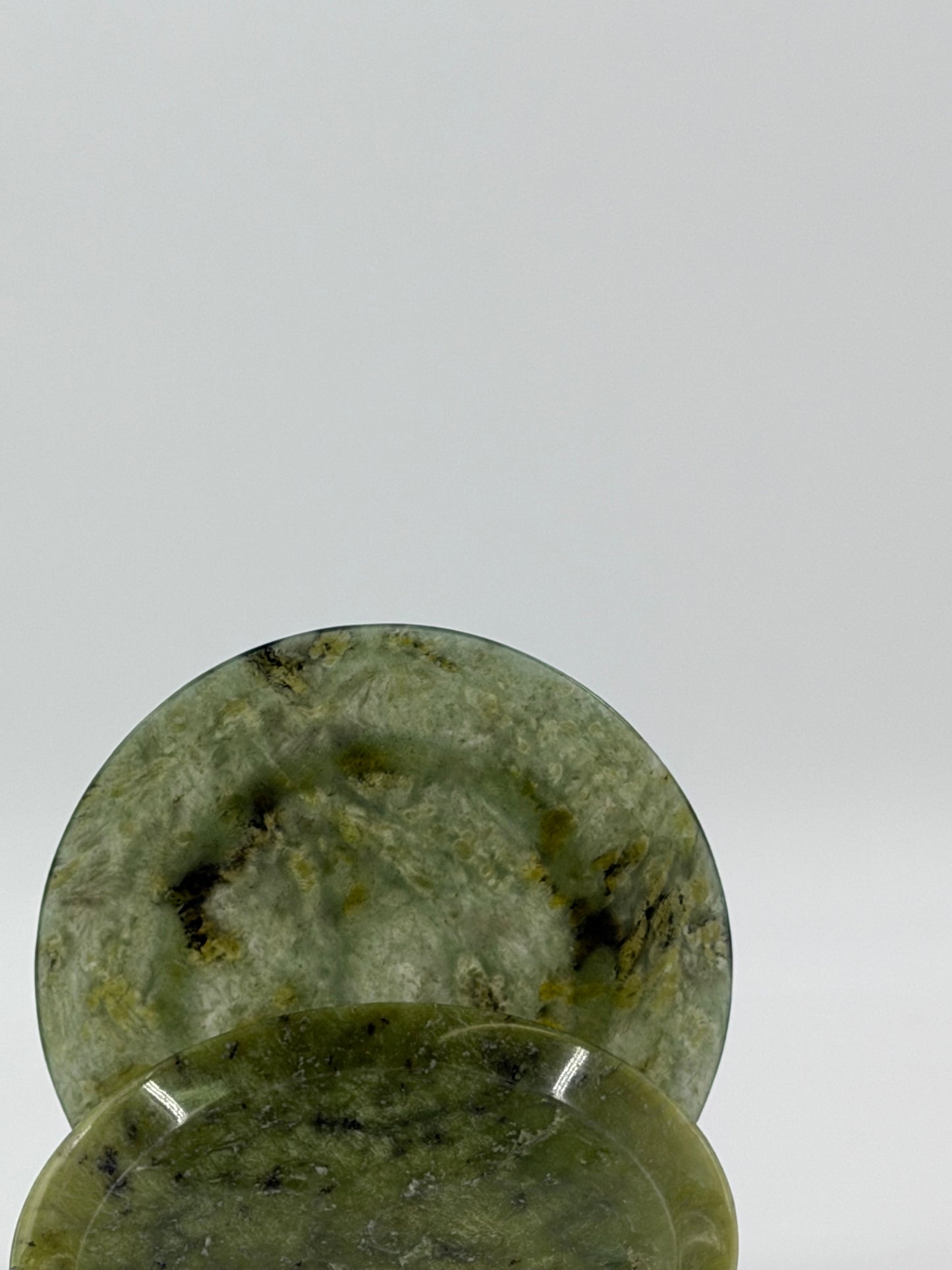 A pair of decorative plates in polished green serpentine